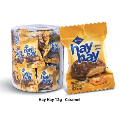 A box of sandwich biscuits covered in cocoa with caramel cream